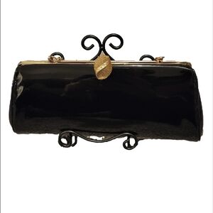 Elegant Black Clutch Bag with gold-tone hinged clasp and gold chain